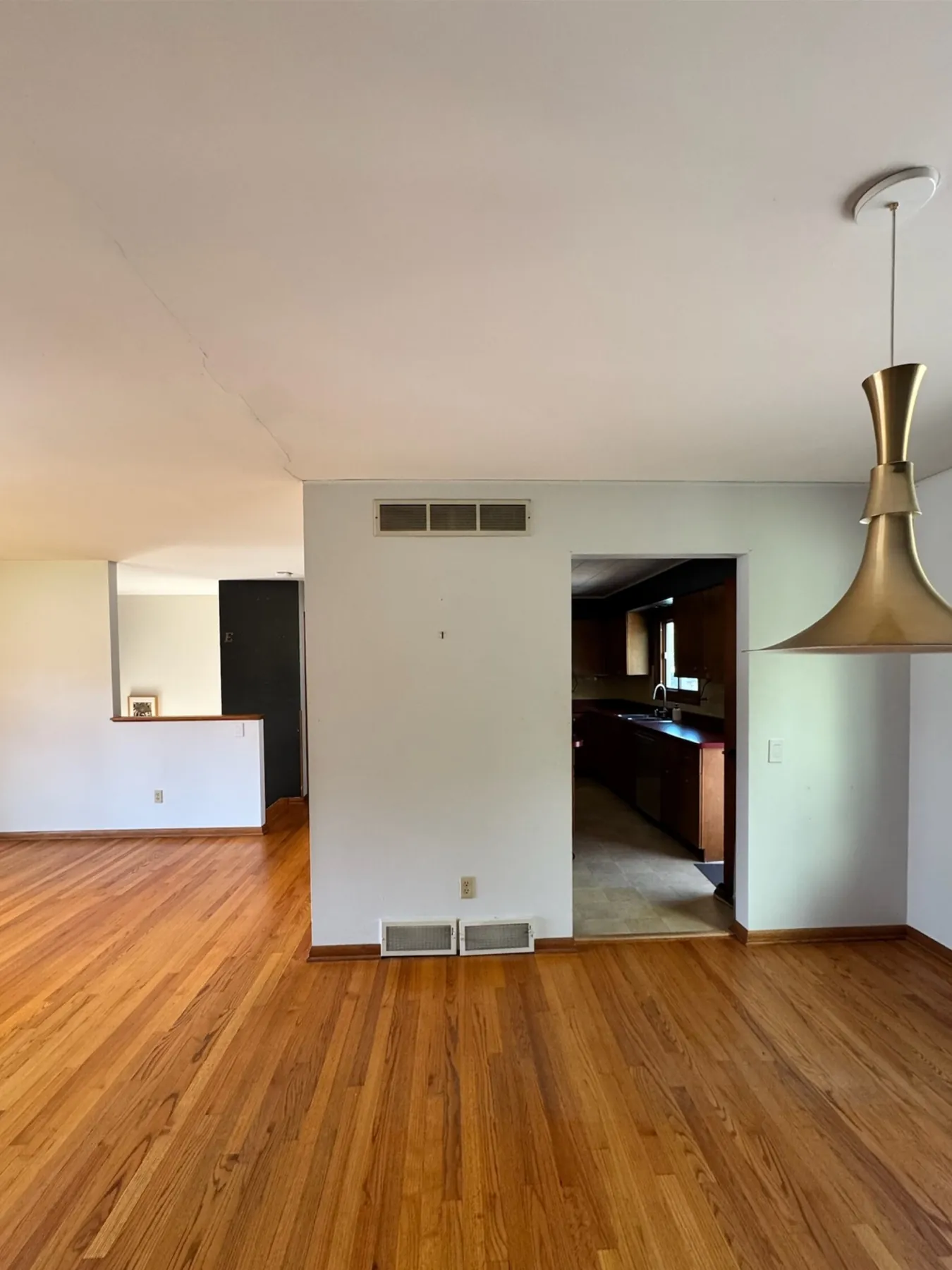 Madison Midcentury Home: Living room: where the wall stood, before