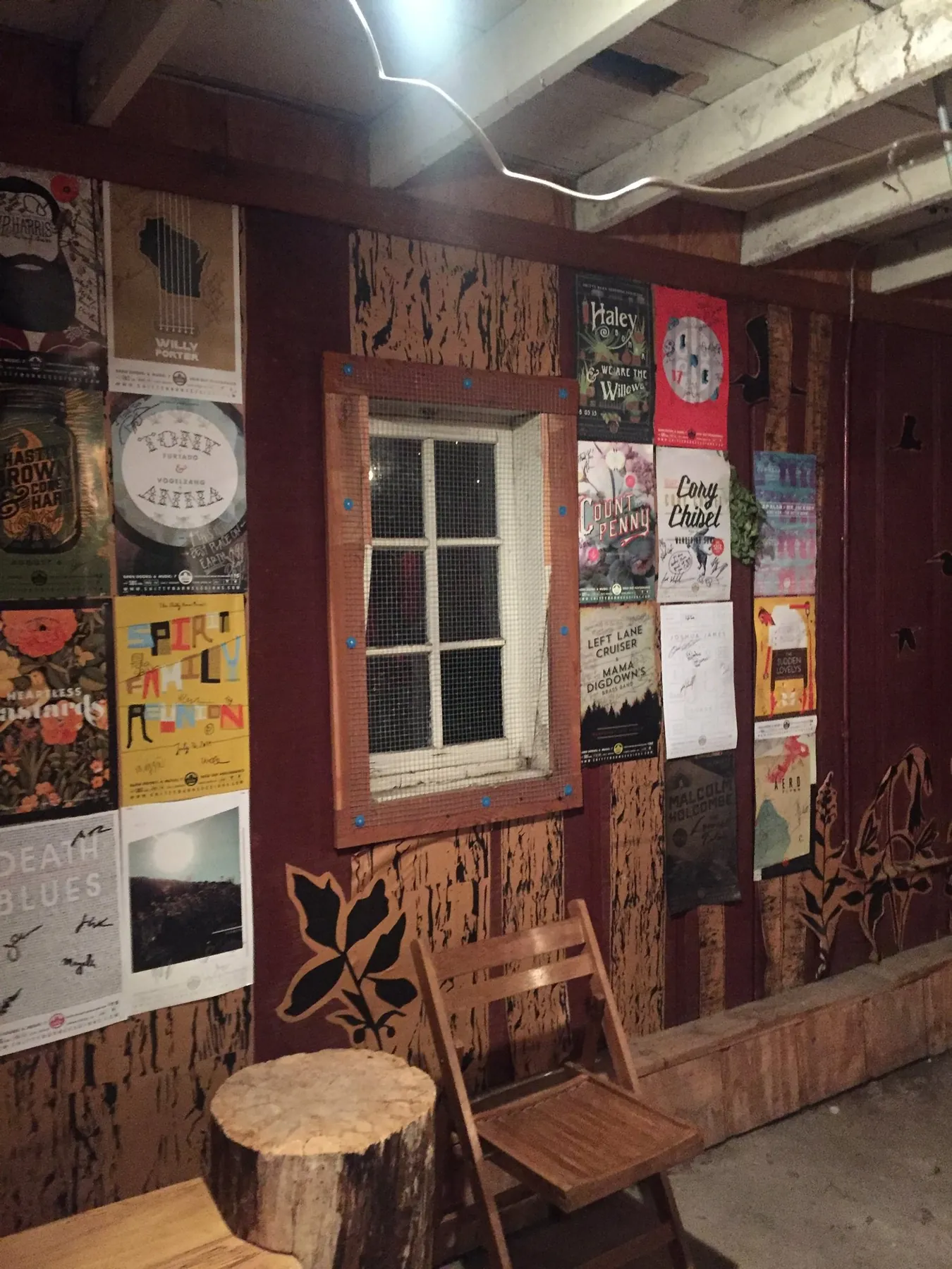 The Shitty Barn: Inside the barn: the poster wall
